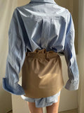 2pc lapel top and belted overlay skirt